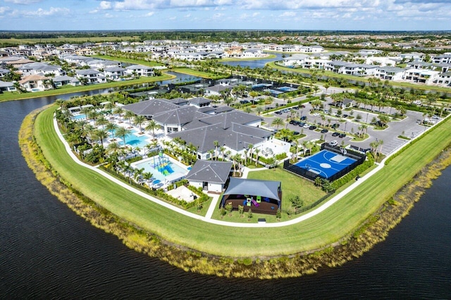 birds eye view of property featuring a water view and a residential view