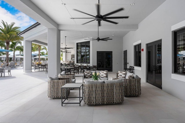 view of patio with an outdoor living space, french doors, ceiling fan, and outdoor dining area