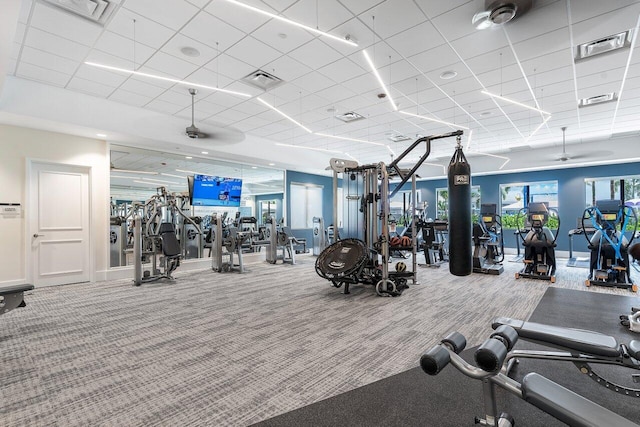 gym featuring carpet flooring, visible vents, and a drop ceiling