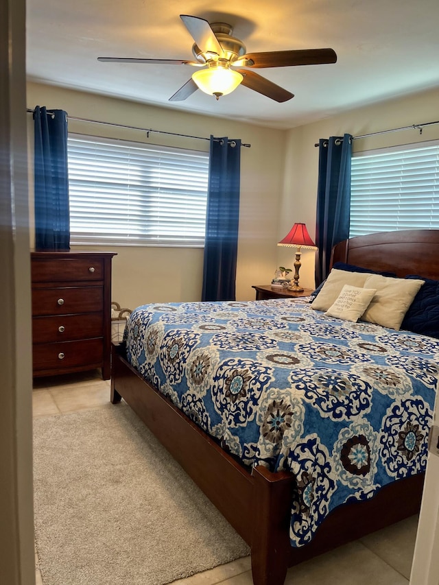 1505 Kingsley Rd, Jupiter, FL 33469 - carpeted bedroom with a ceiling fan and tile patterned floors