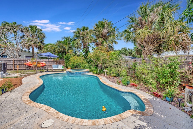 1505 Kingsley Rd, Jupiter, FL 33469 - view of pool featuring a fenced backyard, a pool with connected hot tub, and a patio