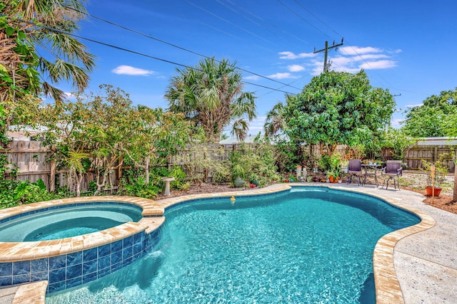 1505 Kingsley Rd, Jupiter, FL 33469 - view of swimming pool with a fenced backyard, a patio area, and a pool with connected hot tub