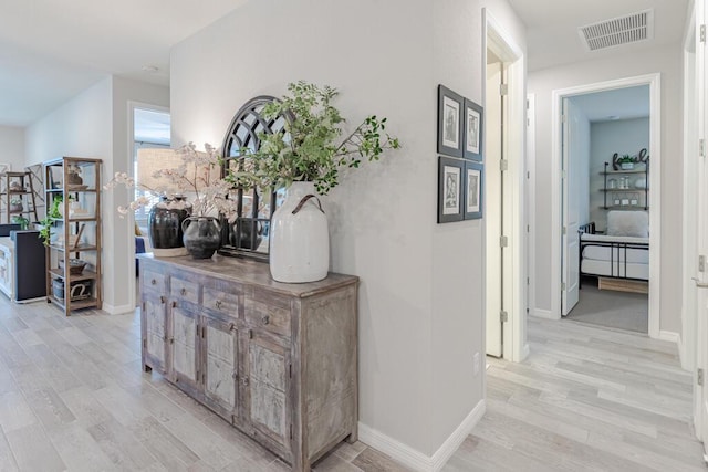 348 SE Courances Dr, Port Saint Lucie, FL 34984 - corridor featuring light wood-style flooring and baseboards