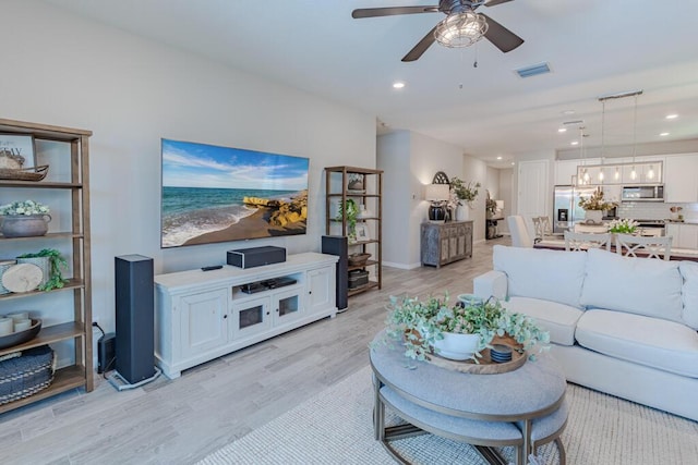 348 SE Courances Dr, Port Saint Lucie, FL 34984 - living room featuring light wood finished floors, a ceiling fan, and recessed lighting