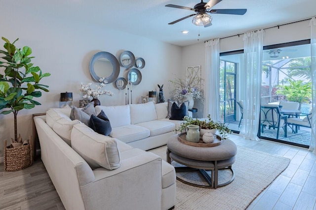 348 SE Courances Dr, Port Saint Lucie, FL 34984 - living area with a ceiling fan, wood finished floors, and recessed lighting