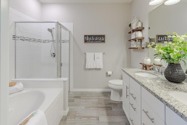 348 SE Courances Dr, Port Saint Lucie, FL 34984 - full bath with a stall shower, double vanity, a bath, and wood finished floors