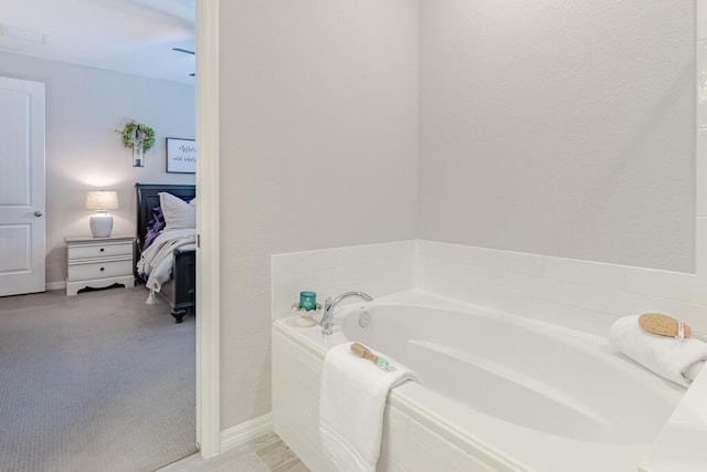 348 SE Courances Dr, Port Saint Lucie, FL 34984 - bathroom featuring a garden tub and ensuite bath
