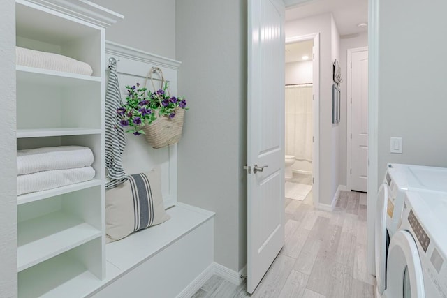 348 SE Courances Dr, Port Saint Lucie, FL 34984 - full bathroom with washing machine and dryer, wood finished floors, and vanity