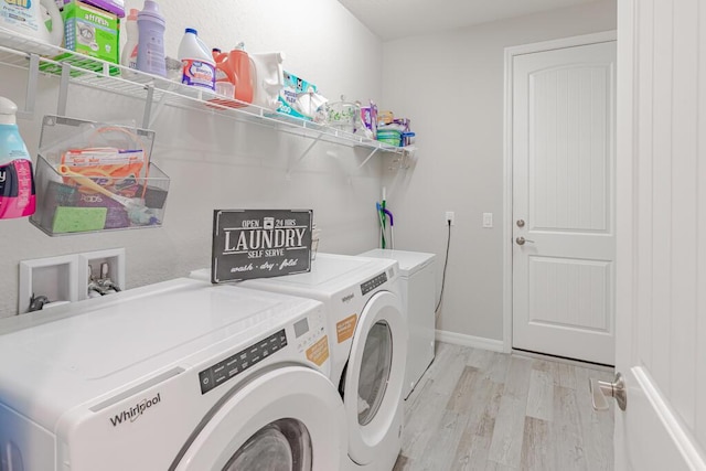 348 SE Courances Dr, Port Saint Lucie, FL 34984 - washroom featuring washer and dryer and light wood-type flooring