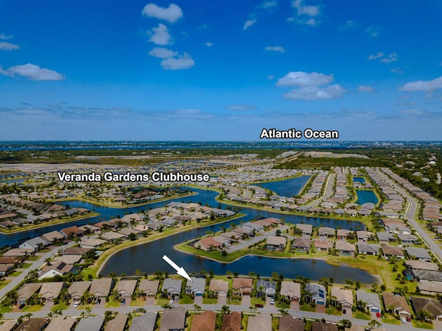 348 SE Courances Dr, Port Saint Lucie, FL 34984 - aerial perspective of suburban area with a nearby body of water