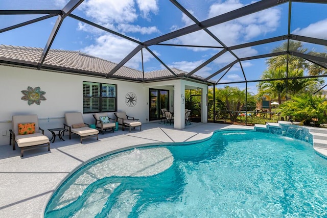 swimming pool featuring a patio area and glass enclosure