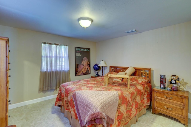 108 NE Carlisle Ln, Port Saint Lucie, FL 34952 - bedroom with visible vents and baseboards