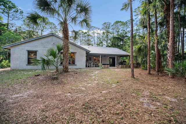 18292 126th Ter N, Jupiter, FL 33478 - rear view of property with stucco siding