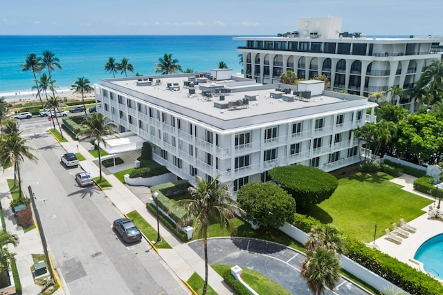birds eye view of property featuring a water view