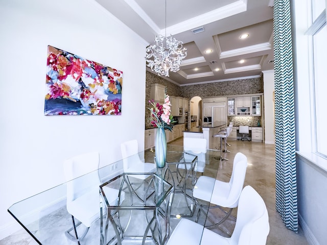dining space featuring a chandelier, recessed lighting, crown molding, coffered ceiling, and arched walkways