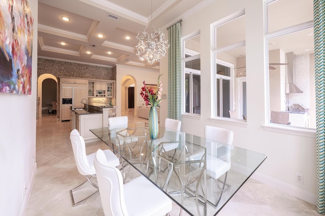 dining space featuring crown molding, arched walkways, and coffered ceiling