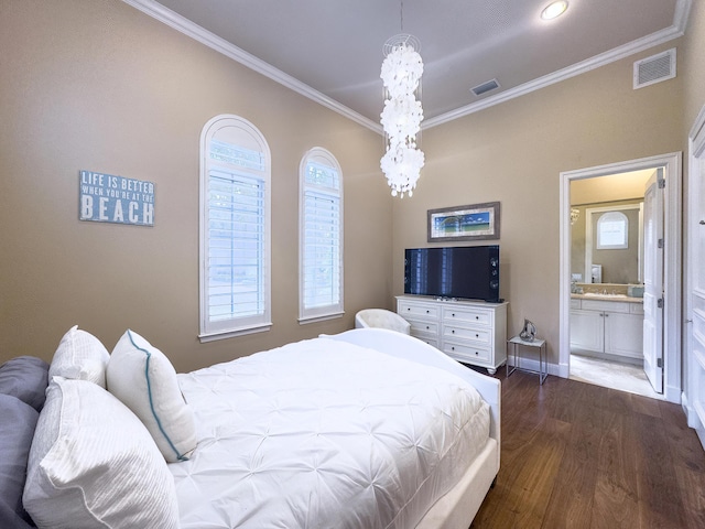 bedroom with crown molding, visible vents, baseboards, and wood finished floors