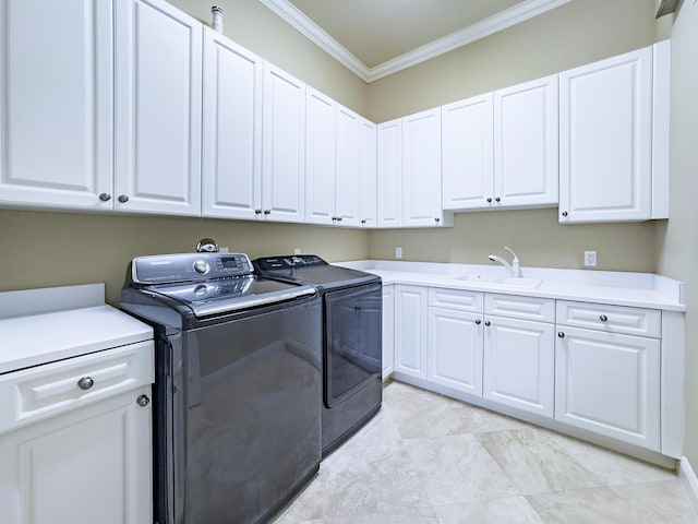 laundry area with separate washer and dryer, a sink, ornamental molding, and cabinet space