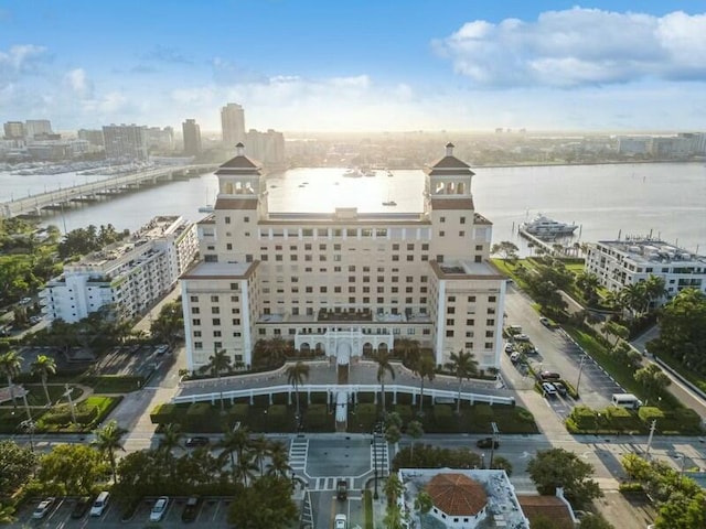 birds eye view of property with a view of city and a water view