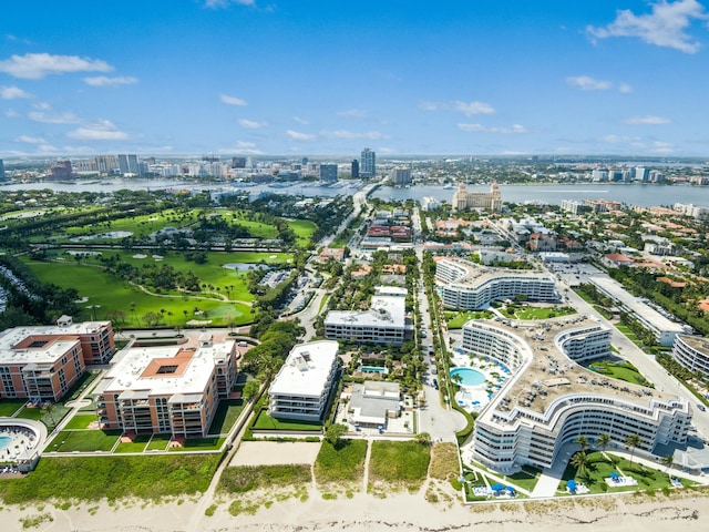 birds eye view of property with a water view and a city view