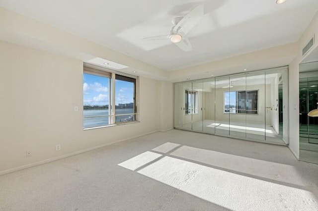 unfurnished bedroom with ceiling fan, carpet floors, recessed lighting, baseboards, and visible vents