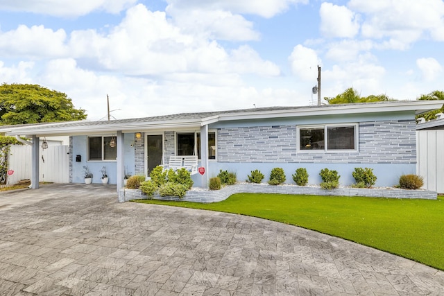 341 NE 49th St, Oakland Park, FL 33334 - single story home with a front lawn