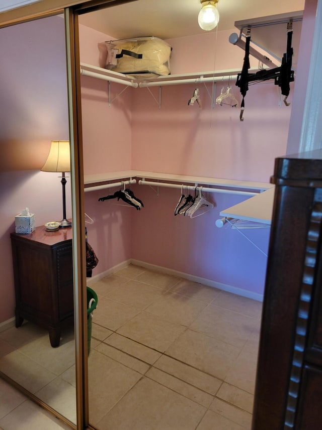 4941 Dovewood Rd Unit A, Boynton Beach, FL 33436 - walk in closet with light tile patterned floors