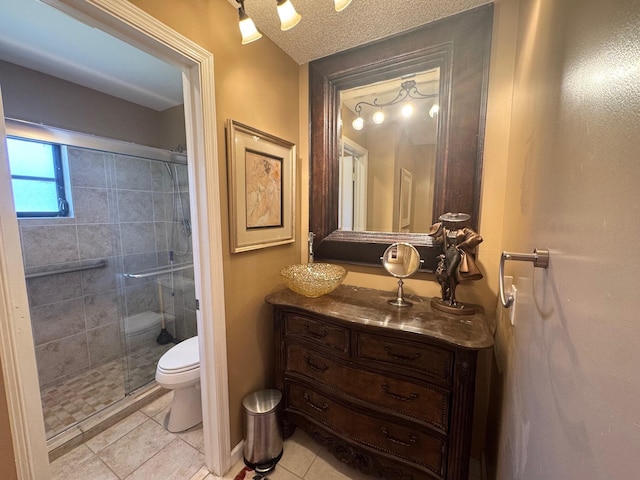 4941 Dovewood Rd Unit A, Boynton Beach, FL 33436 - bathroom with tile patterned floors, vanity, a shower stall, and toilet