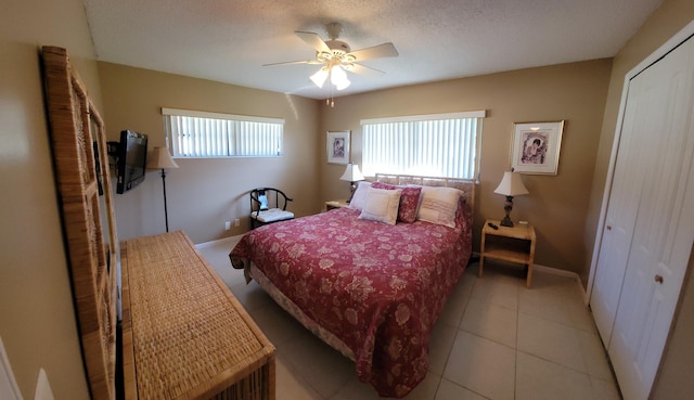 4941 Dovewood Rd Unit A, Boynton Beach, FL 33436 - bedroom featuring a closet, light tile patterned floors, baseboards, and a ceiling fan