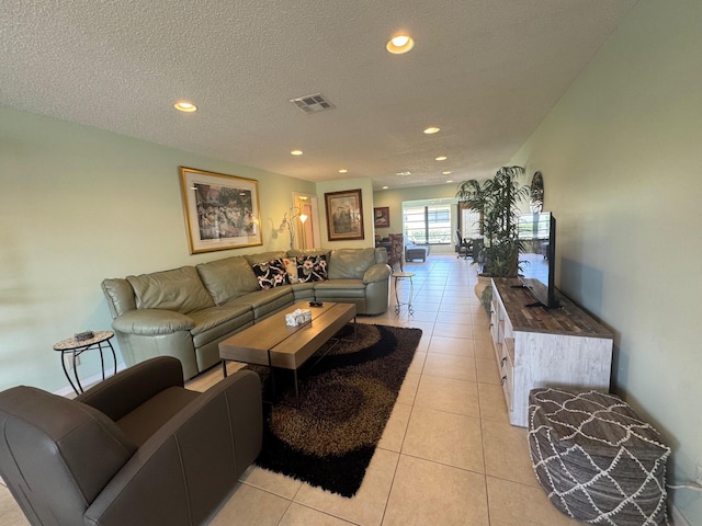 4941 Dovewood Rd Unit A, Boynton Beach, FL 33436 - living room with light tile patterned flooring, a textured ceiling, visible vents, and recessed lighting