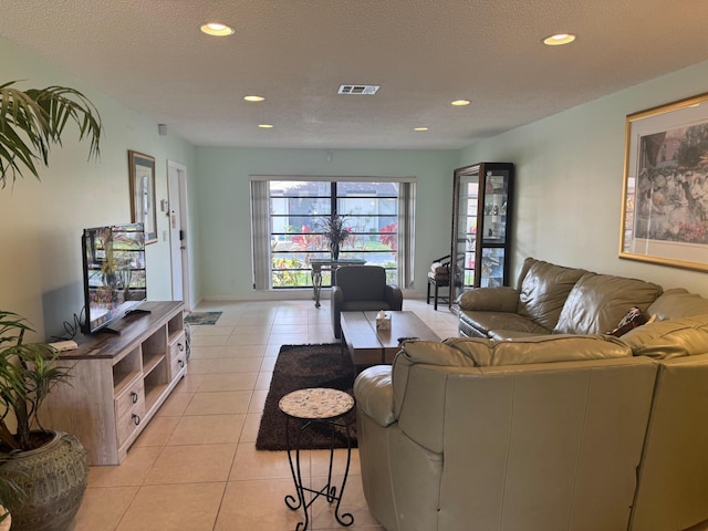 4941 Dovewood Rd Unit A, Boynton Beach, FL 33436 - living room with baseboards, recessed lighting, visible vents, and light tile patterned floors