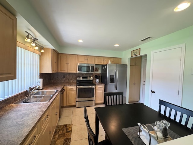 4941 Dovewood Rd Unit A, Boynton Beach, FL 33436 - kitchen with stainless steel appliances, light brown cabinetry, a sink, tasteful backsplash, and visible vents