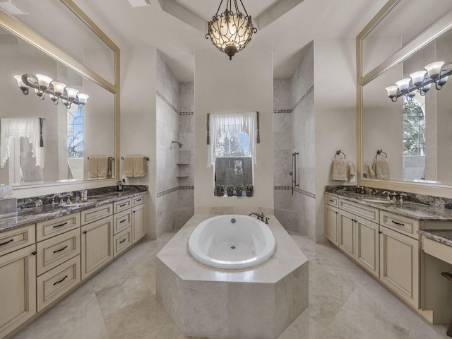 17384 Vistancia Cir, Boca Raton, FL 33496 - full bathroom with two vanities, an inviting chandelier, walk in shower, a bath, and a sink
