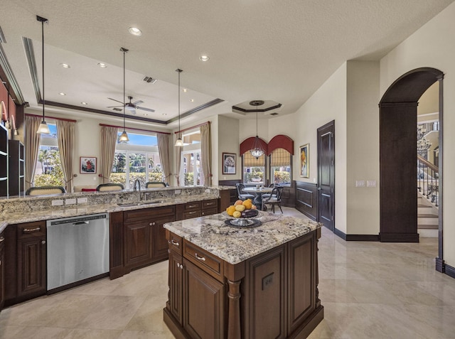 17384 Vistancia Cir, Boca Raton, FL 33496 - kitchen with ceiling fan, a tray ceiling, arched walkways, dishwasher, and a sink