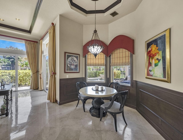 17384 Vistancia Cir, Boca Raton, FL 33496 - dining area with visible vents, a tray ceiling, and ornamental molding