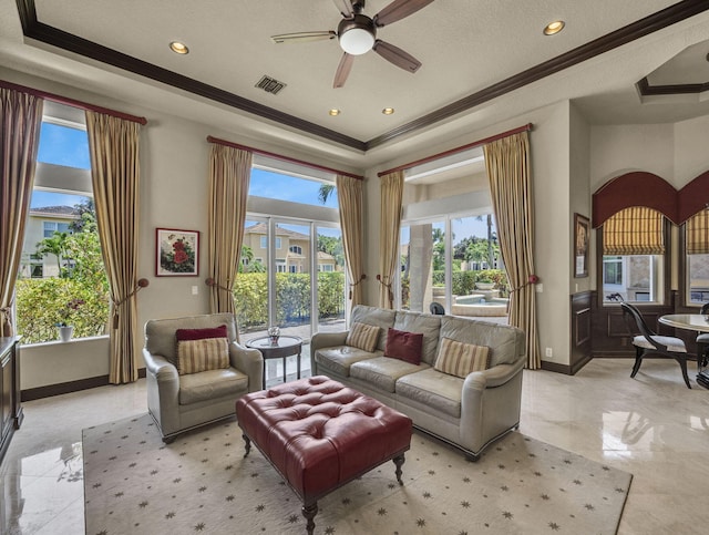 17384 Vistancia Cir, Boca Raton, FL 33496 - living area featuring baseboards, a raised ceiling, crown molding, visible vents, and ceiling fan