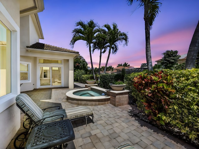 17384 Vistancia Cir, Boca Raton, FL 33496 - patio terrace at dusk with an outdoor hot tub