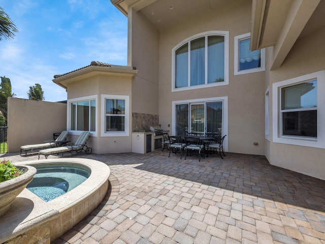 17384 Vistancia Cir, Boca Raton, FL 33496 - exterior space featuring exterior kitchen, a patio area, stucco siding, and outdoor dining space