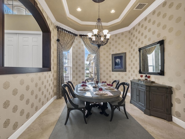 17384 Vistancia Cir, Boca Raton, FL 33496 - dining space with a notable chandelier, baseboards, crown molding, visible vents, and a tray ceiling
