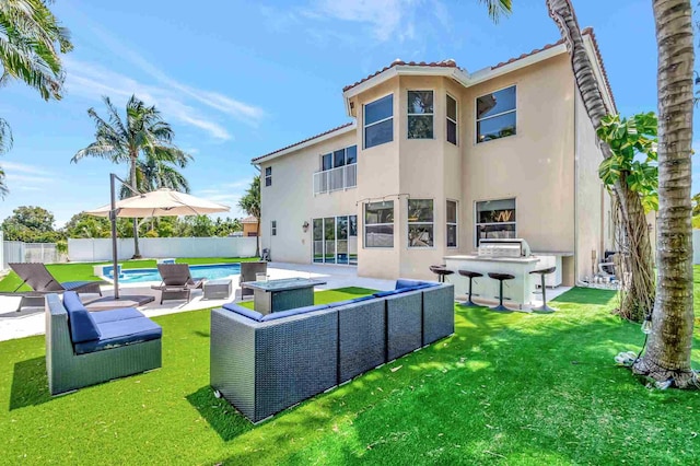 rear view of property with stucco siding, outdoor lounge area, a patio area, and a tiled roof