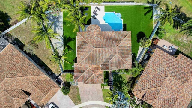 view of subject property with a pool