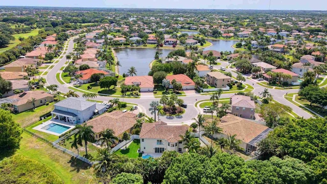 aerial perspective of suburban area featuring a nearby body of water