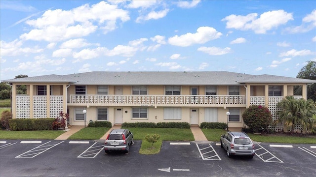 1905 NW 18th St Unit 101, Delray Beach, FL 33445 - view of property featuring uncovered parking