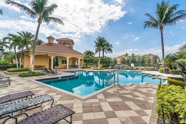 community pool with a patio area