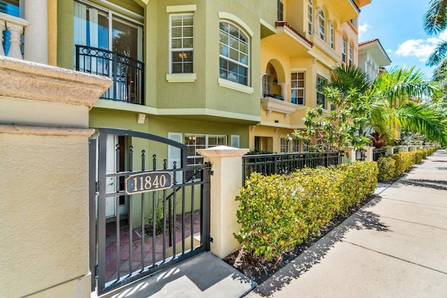 view of building exterior with a fenced front yard