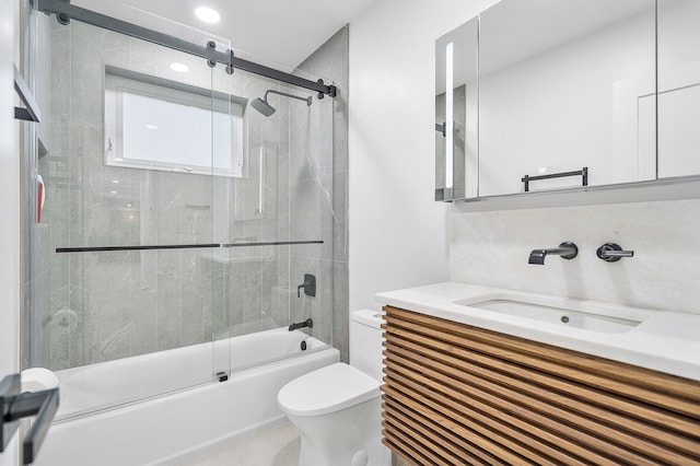 full bathroom with toilet, enclosed tub / shower combo, and vanity