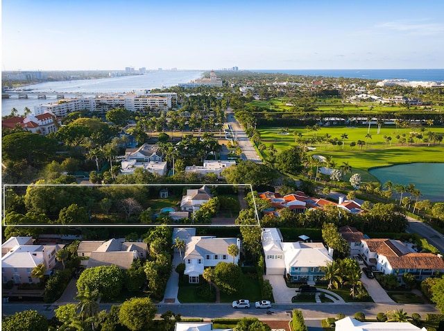 drone / aerial view featuring a water view and a residential view