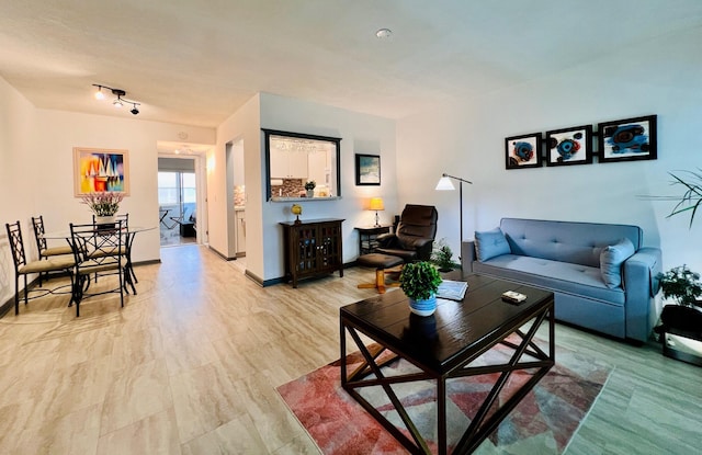 135 Dorchester F, West Palm Beach, FL 33417 - living room featuring baseboards