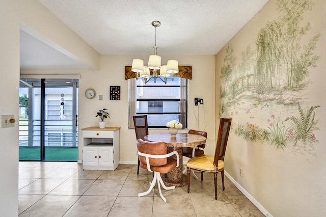475 Piedmont J, Delray Beach, FL 33484 - dining room with baseboards, light tile patterned flooring, a notable chandelier, and a textured ceiling