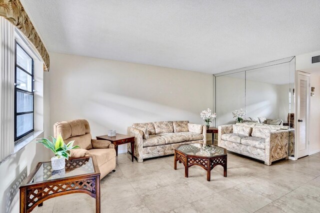 475 Piedmont J, Delray Beach, FL 33484 - living room with a textured ceiling and visible vents